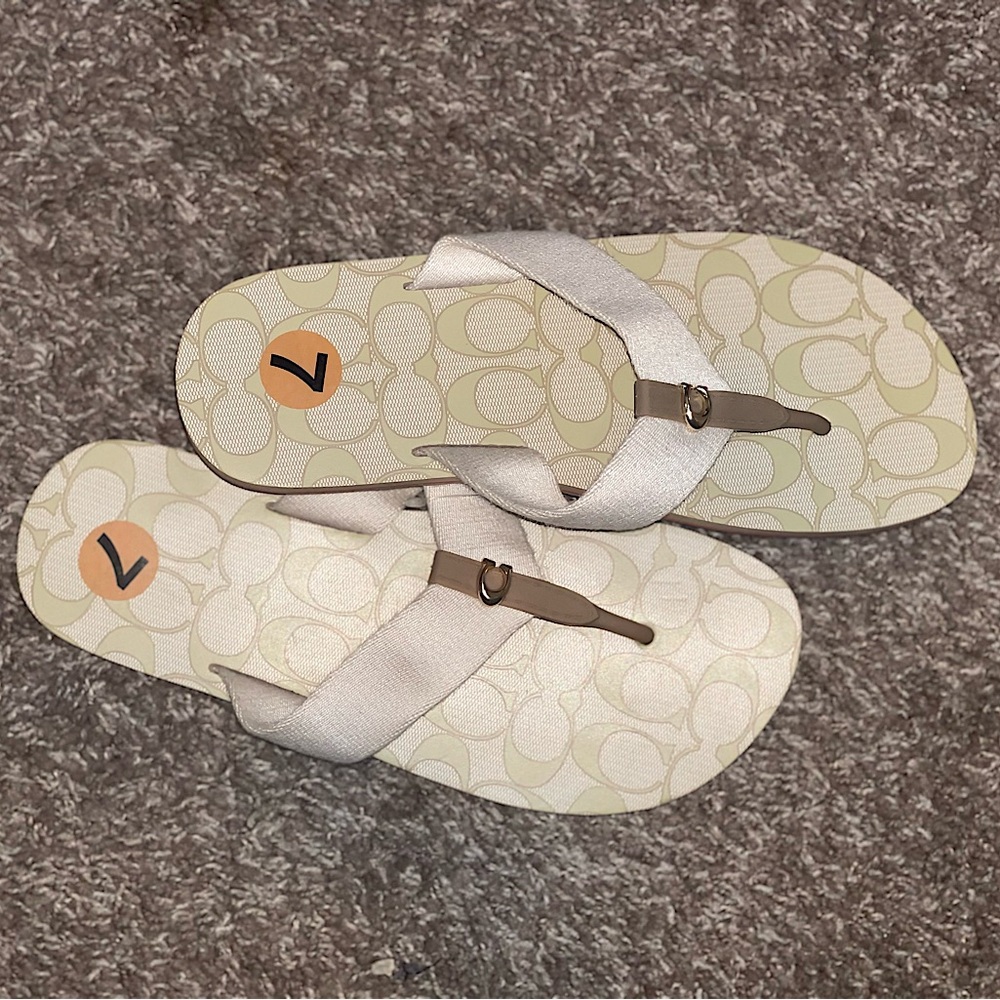 Selling coach slippers/sandals which are green/creamish color. neutral and cute.